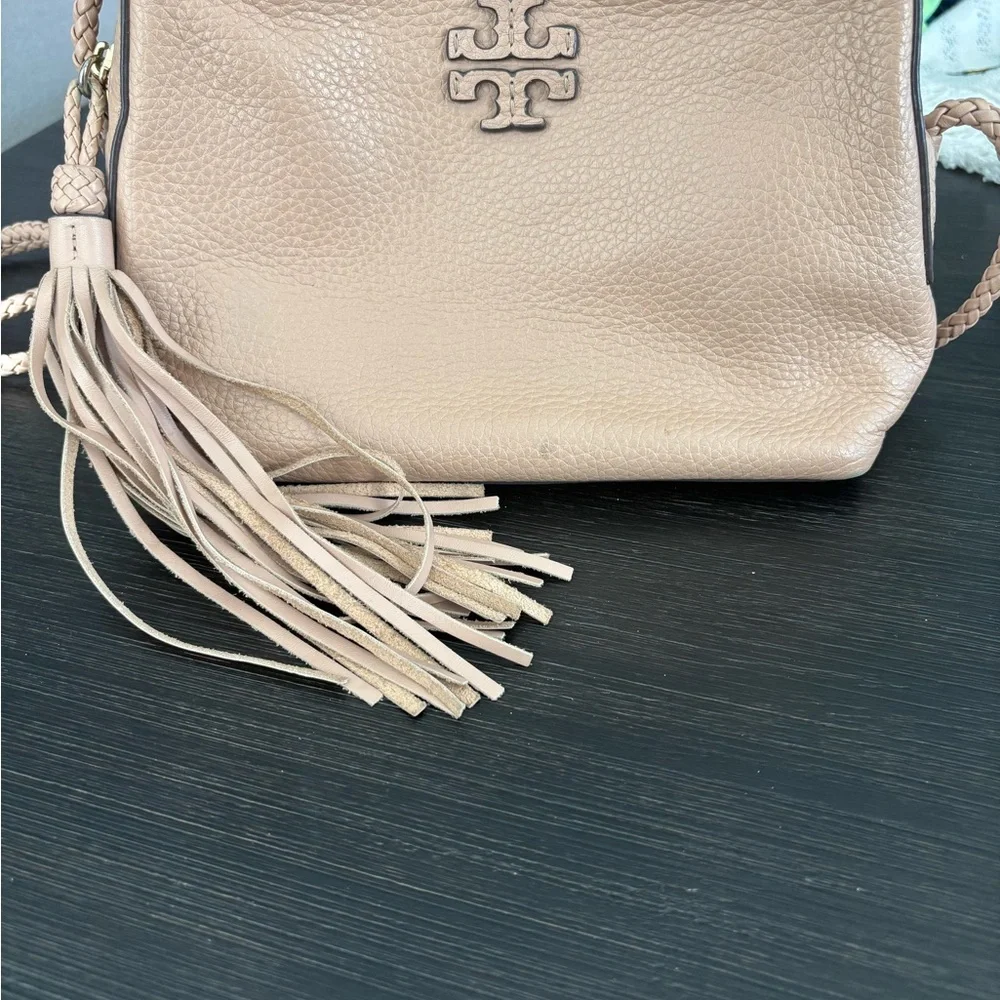 Tory Burch Pebbled Leather Tassel Crossbody in Beige